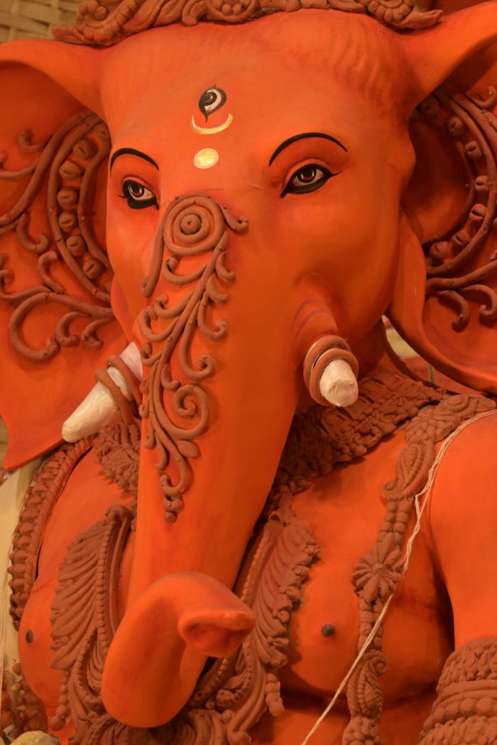 Close-up of a vibrant Ganesha idol with detailed decorations for Durga Puja in Kolkata.
