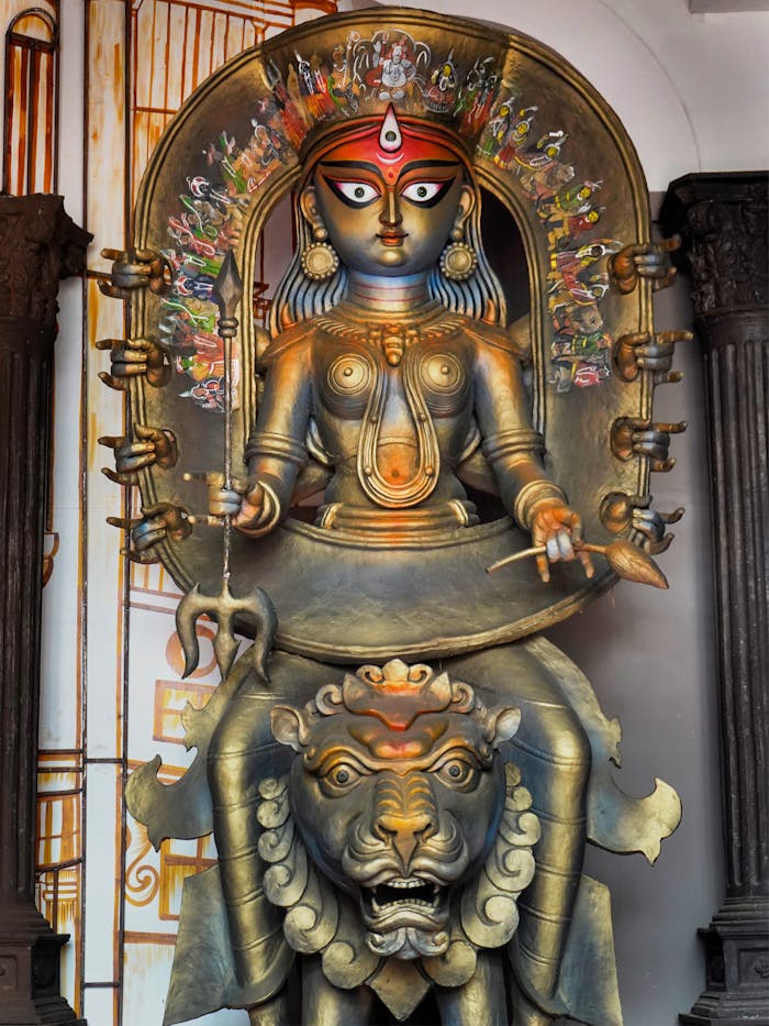 Detailed photo of Goddess Durga idol at a Kolkata festival, showcasing artistic craftsmanship.