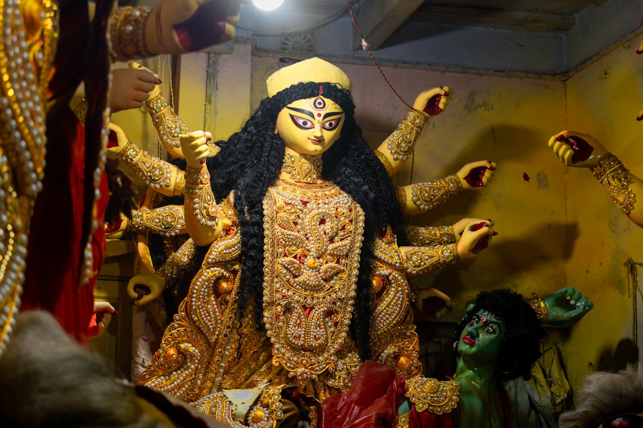 Intricate Goddess Durga idol preparation for Durga Puja in Kolkata, India.