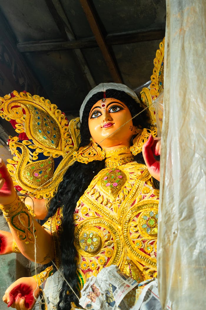 Exquisite clay idol of Goddess Durga being crafted for Durga Puja in Kolkata's Kumartuli.