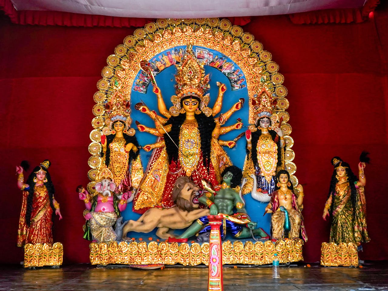 Intricate Durga Puja idols displayed during the festival in Kumartuli, Kolkata, showcasing rich Bengali culture.