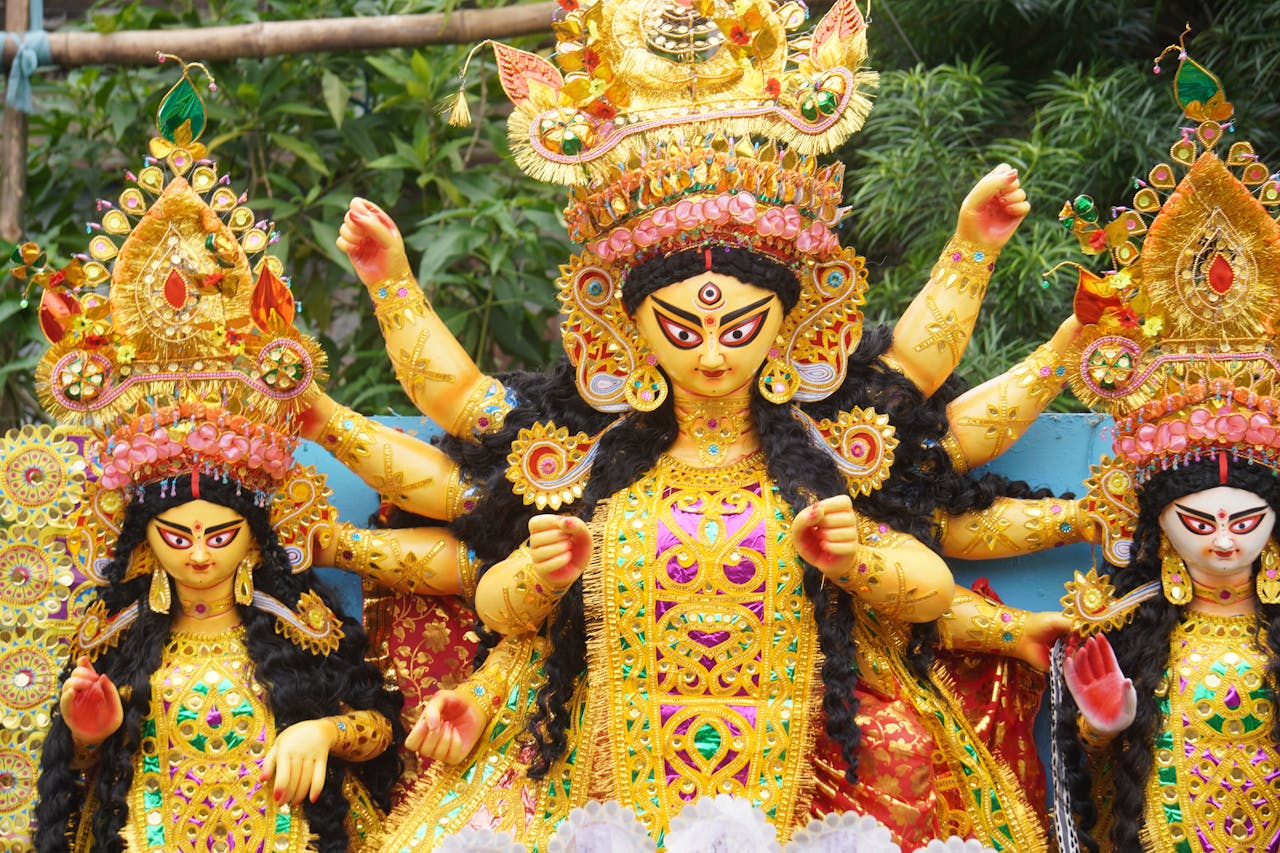 Vibrant and intricately designed Durga idols at a Kolkata festival, celebrating Durga Puja.
